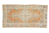 Vintage Distressed Oushak runner with faded burnt orange diamond medallion and ivory field, 2'8