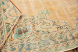Distressed Oushak pile, mostly even wear, localized foundation, faded apricot Rococo motifs.