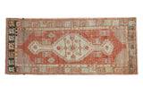 Vintage Distressed Oushak runner, cinnabar red field and ivory medallion, 2'4