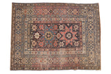 Antique Shirvan rug, geometric double star medallion, starburst patterns, dusty red, navy, and beige tones.