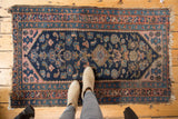 Vintage Kurdish Hamadan rug, navy blue Herati motif, diamond medallion, blush pink spandrels, and wear.