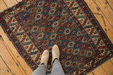 Antique Shirvan rug with allover diminutive gul motifs and geometric serrated leaf border.
