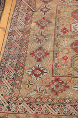 Intricate geometric borders and repeating guls on this late 19th century Caucasian hand-knotted rug.