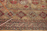 Antique Caucasian rug with geometric guls and intricate borders in earthy tones.