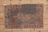 Antique Senneh rug corner, Herati motif, frayed fringe, and original adhered backing.