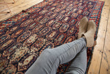 Antique Caucasian runner, allover staggered botehs in navy, wine, sand, with even pile wear.