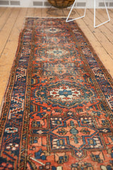 Vintage Heriz rug border, oversized serrated leaves in dusty brick red and navy.