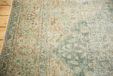 Distressed pile texture with aqua green, powder blue, beige, and sand floral patterns.