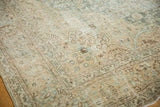 Vintage Distressed Tabriz carpet showing mostly even wear with aqua, beige, brown floral motifs.