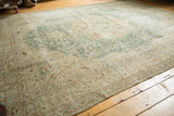 Distressed vintage Tabriz carpet, mostly even wear, foundation visible, faded aqua and beige.