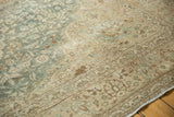 Distressed texture of aqua, beige, brown floral patterns with wear to knot heads.