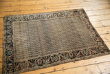 Antique Farahan Sarouk rug's intricate border, showing rare design and meandering waves.