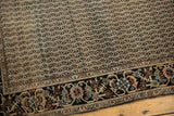 Rare floral border and intricate channel of water field on an antique Farahan Sarouk rug.