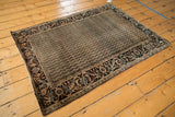Corner of antique Farahan Sarouk rug, intricate floral border with channel water motif.