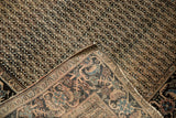 Antique Farahan Sarouk rug corner showing intricate border and unique striped foundation.