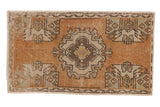 Vintage distressed Oushak rug mat, faded tangerine and ivory roundel design, 1'8