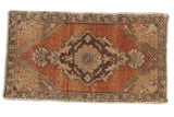 Vintage Distressed Oushak rug mat featuring a faded floral medallion on an abrashed brick red field.