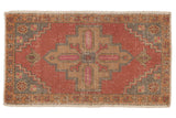 Distressed vintage Oushak rug, geometric medallion in dusty blush, beige, and slate blue.