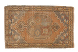 Distressed hand-knotted Oushak mat with apricot scalloped medallion and slate blue spandrels.