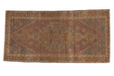 Distressed Oushak rug, elongated medallion, dusty purple, sand, and blush hues. 1'9