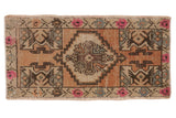 Vintage distressed Oushak rug mat with diamond medallion, florals, beige, apricot, pink, slate blue.
