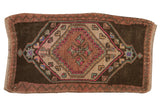 Distressed Oushak rug, playful asymmetric geometric medallion in charcoal, dusty mauve, teal.