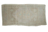 Distressed vintage Oushak rug with subtle stepped medallion, muted beige and pale seafoam tones.