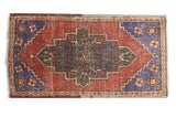 Vintage Distressed Oushak mat runner with geometric medallion in brick red, faded denim blue. 1'9