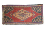 Vintage distressed Oushak runner with red field, apricot geometric medallion, and slate blue corners.