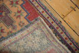 Hand-knotted reverse of vintage Oushak rug showing foundation, intact side selvage, and painted number.