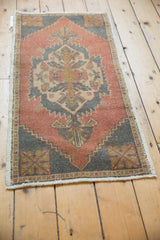 Intact side cord selvage and worn diamond corner spandrel of the vintage Oushak rug.