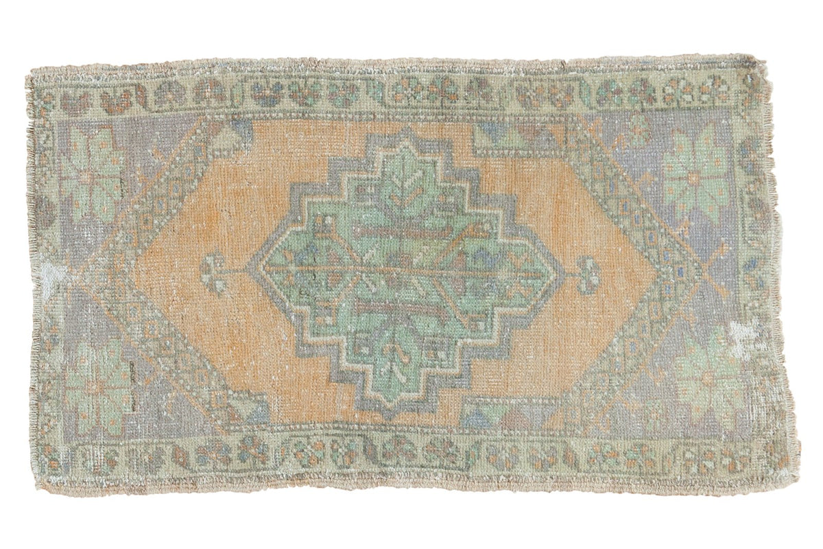 Vintage Distressed Oushak rug with apricot gold medallion and pistachio, slate blue colors.