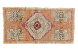 Distressed vintage Oushak rug mat, apricot field, ivory stepped medallion, fuchsia details. 1'6