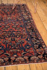 Lilihan rug runner's patterned end with navy border and bright white fringe.