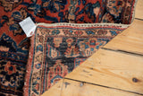 Hand-knotted Persian Lilihan rug runner back showing intricate weave and patterned edge.