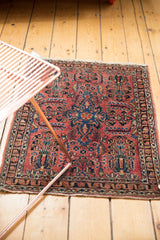 Vintage Fine Sarouk rug with dusty raspberry field, navy tree-of-life motif, and floral patterns.