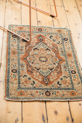 Antique Haji Jalili Tabriz corner shows barber pole borders, vine motifs, and tattered edge.