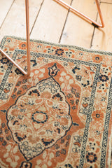 Antique Haji Jalili Tabriz rug's barber pole and meandering vine borders in dusty rust and navy.
