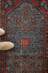 Aqua blue field with red Herati pattern and textured pile on vintage Malayer rug.