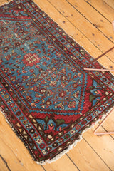 Vintage Malayer rug with an aqua blue Herati field, subtle abrash, red geometric border, and tattered end.