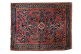 Vintage American Sarouk rug mat, brick red field, intricate floral medallion, navy blue border. 1'11