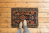 Vintage Borchalou rug mat displaying navy, gold, ivory palmette medallion, worn ends, 1'9