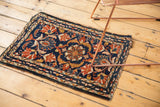 Intricate border design of a vintage Borchalou rug, featuring palmette motifs and tattered edge.