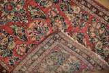 Sarouk rug folded corner, showing hand knotted foundation, secure side, and fringe.