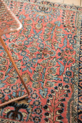 Hand-knotted Dargezine rug with intricate Sarouk style floral motifs in dark blush, sky blue, and beige.