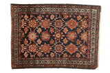 Vintage Lilihan rug with Veramin floral pattern in navy, madder red, and ivory tones.