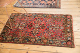 Angled view of Vintage Dargezine Rug Runner, rich dusty brick red and blue Sarouk-style floral field.