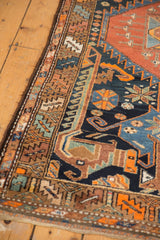 Vintage Kurdish Hamadan rug's intricate geometric border features navy, orange, and brown details.