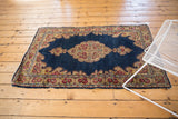 Vintage Kerman rug corner with European Rococo spandrel and rose patterned border.