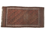 Antique Belouch runner: chestnut and charcoal lattice of germinating flower motifs, showing wear.